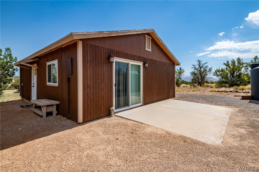 10363 East Blake Ranch Road Kingman, AZ 86401 - Photo 72 of 79 a front view of a house with a yard