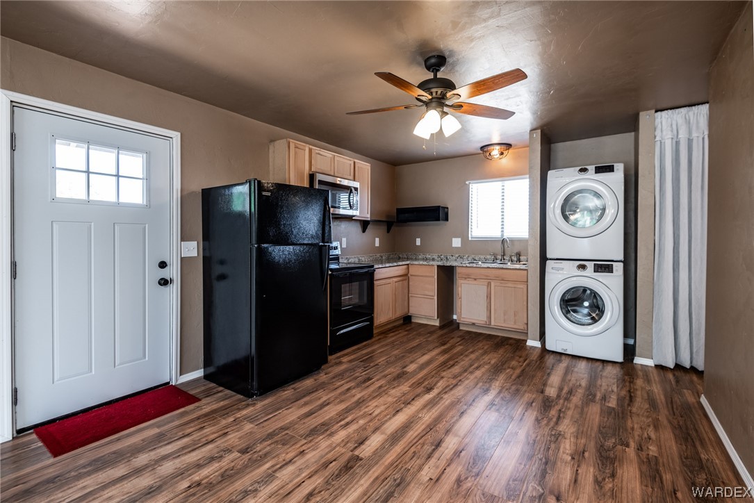 10363 East Blake Ranch Road Kingman, AZ 86401 - Photo 74 of 79 a kitchen with stainless steel appliances granite countertop a refrigerator a stove and a sink