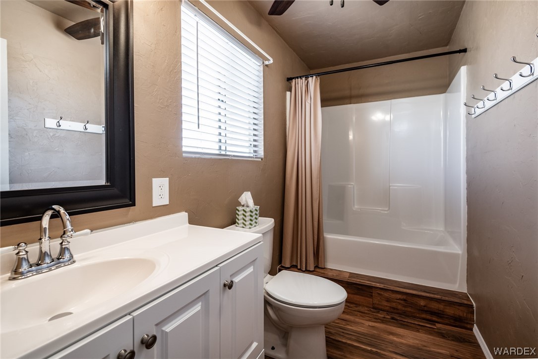 10363 East Blake Ranch Road Kingman, AZ 86401 - Photo 77 of 79 a bathroom with a sink toilet and shower
