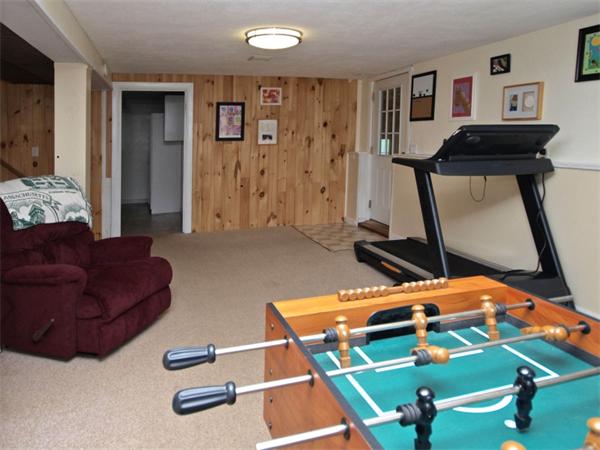 42 Felch Road Natick, MA 01760 - Photo 14 of 21 a room with gym equipment and a table