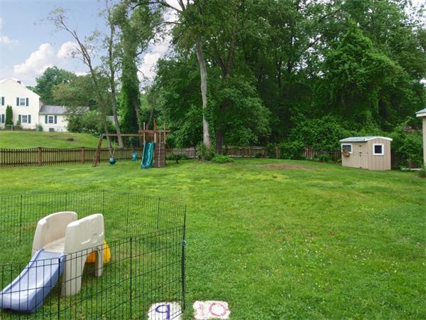 42 Felch Road Natick, MA 01760 - Photo 16 of 21 a backyard of a house with table and chairs