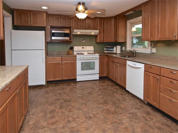 42 Felch Road Natick, MA 01760 - Photo 5 of 21 a kitchen with a refrigerator sink and cabinets