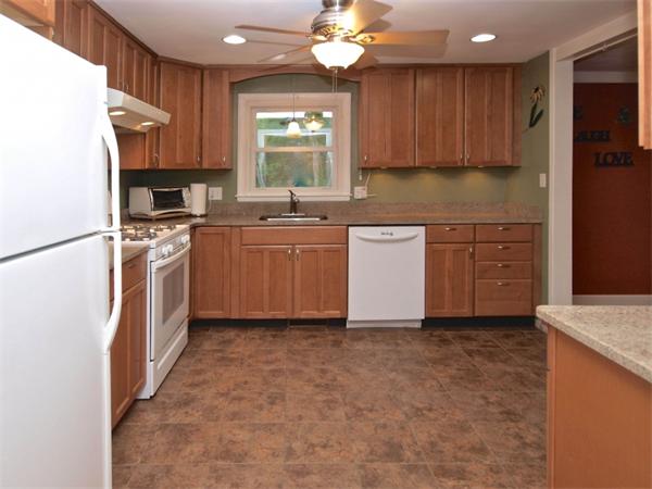 42 Felch Road Natick, MA 01760 - Photo 6 of 21 a kitchen with a refrigerator stove top oven and sink