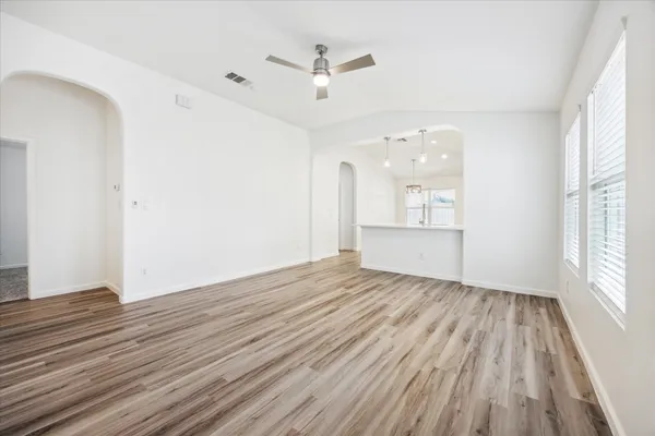 wooden floor in an empty room with a window