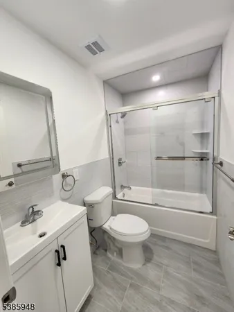 a bathroom with a toilet and a sink