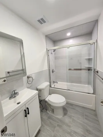 a bathroom with a toilet and a sink