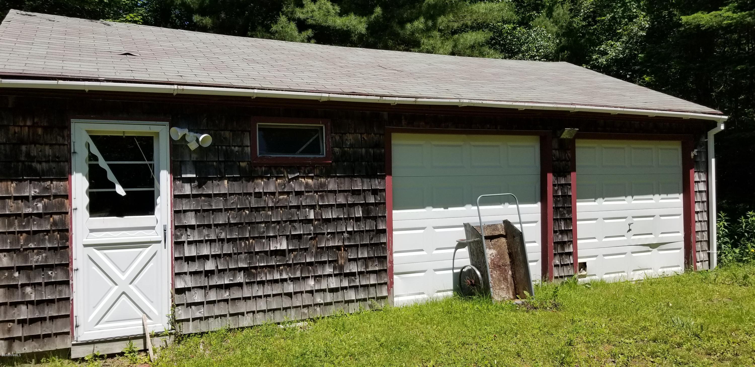 25 Leonhardt Road Becket, MA 01223 - Photo 4 of 12 a front view of a house with a garden