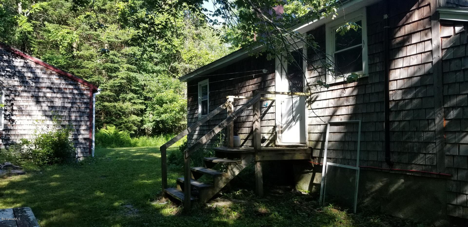 25 Leonhardt Road Becket, MA 01223 - Photo 5 of 12 a backyard of a house with lots of green space