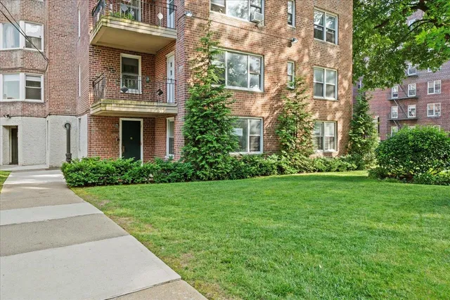 a view of a building with a yard