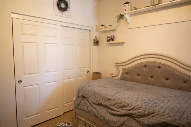 a bedroom with a bed and a shower
