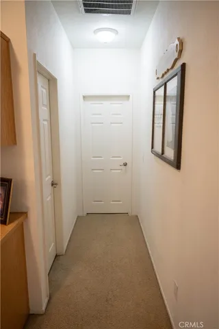 a bedroom with a bed and a desk