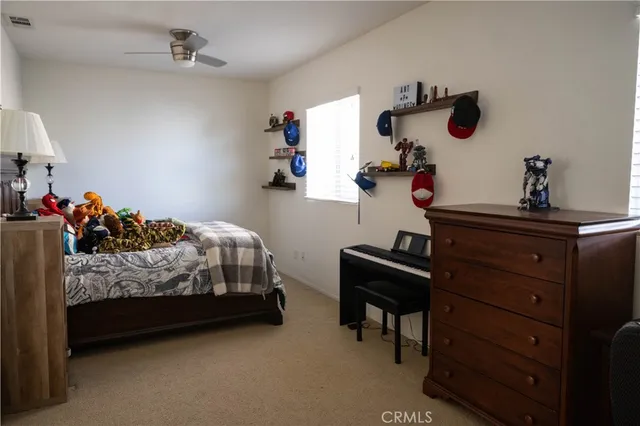 a bedroom with furniture and a window