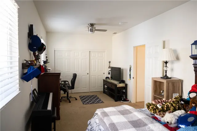 a bathroom with a double vanity sink toilet and mirror