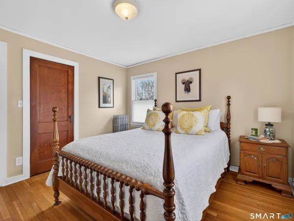 a living room with furniture and a book shelf