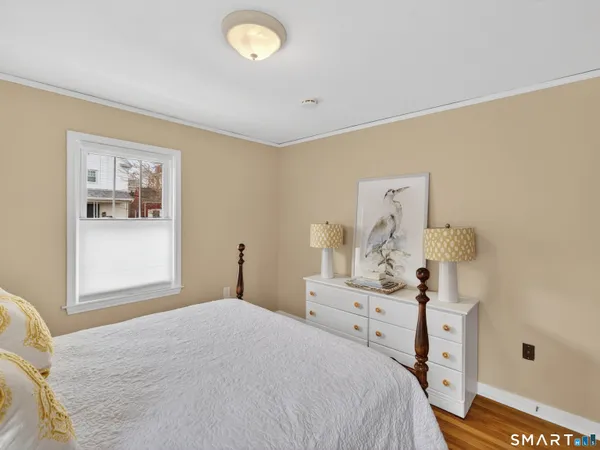 a view of livingroom with hardwood floor and white cabinet