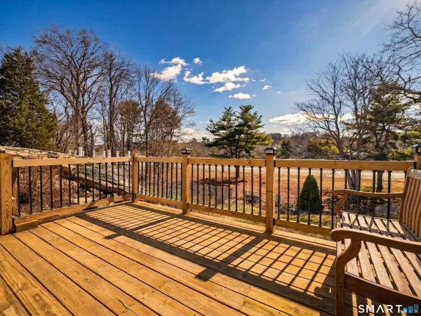 a view of a yard with wooden fence