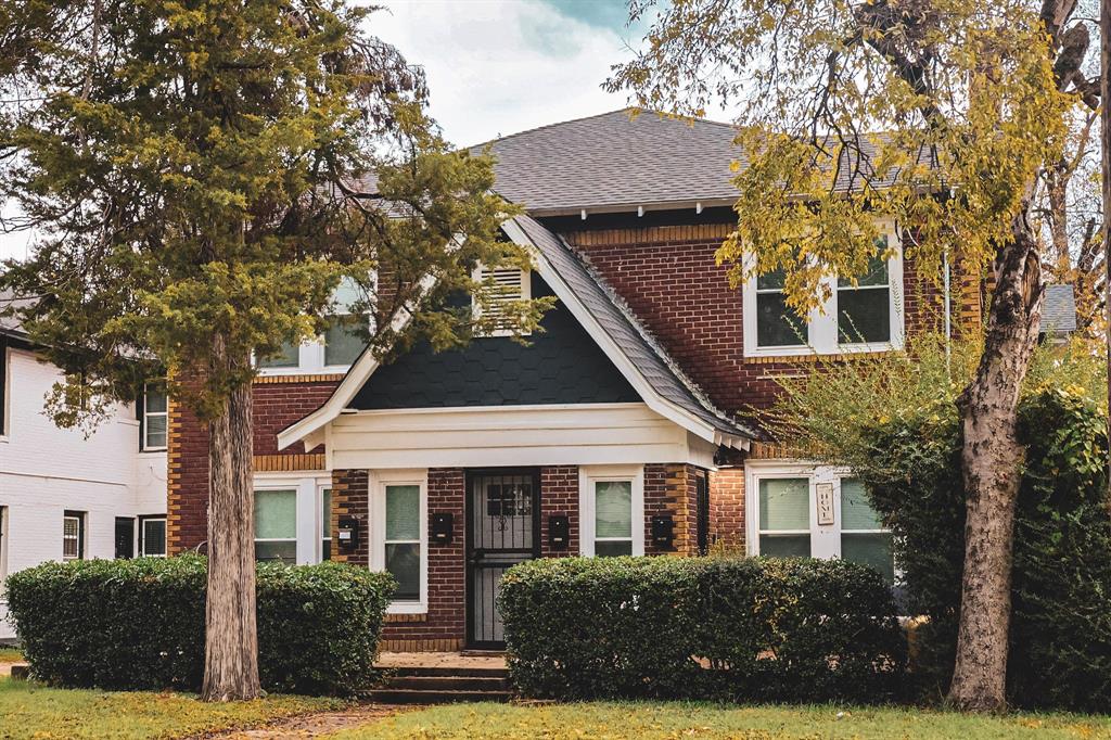 4114 Junius Street, Unit B Dallas, TX 75246 - Photo 1 of 13 front view of a house with a yard