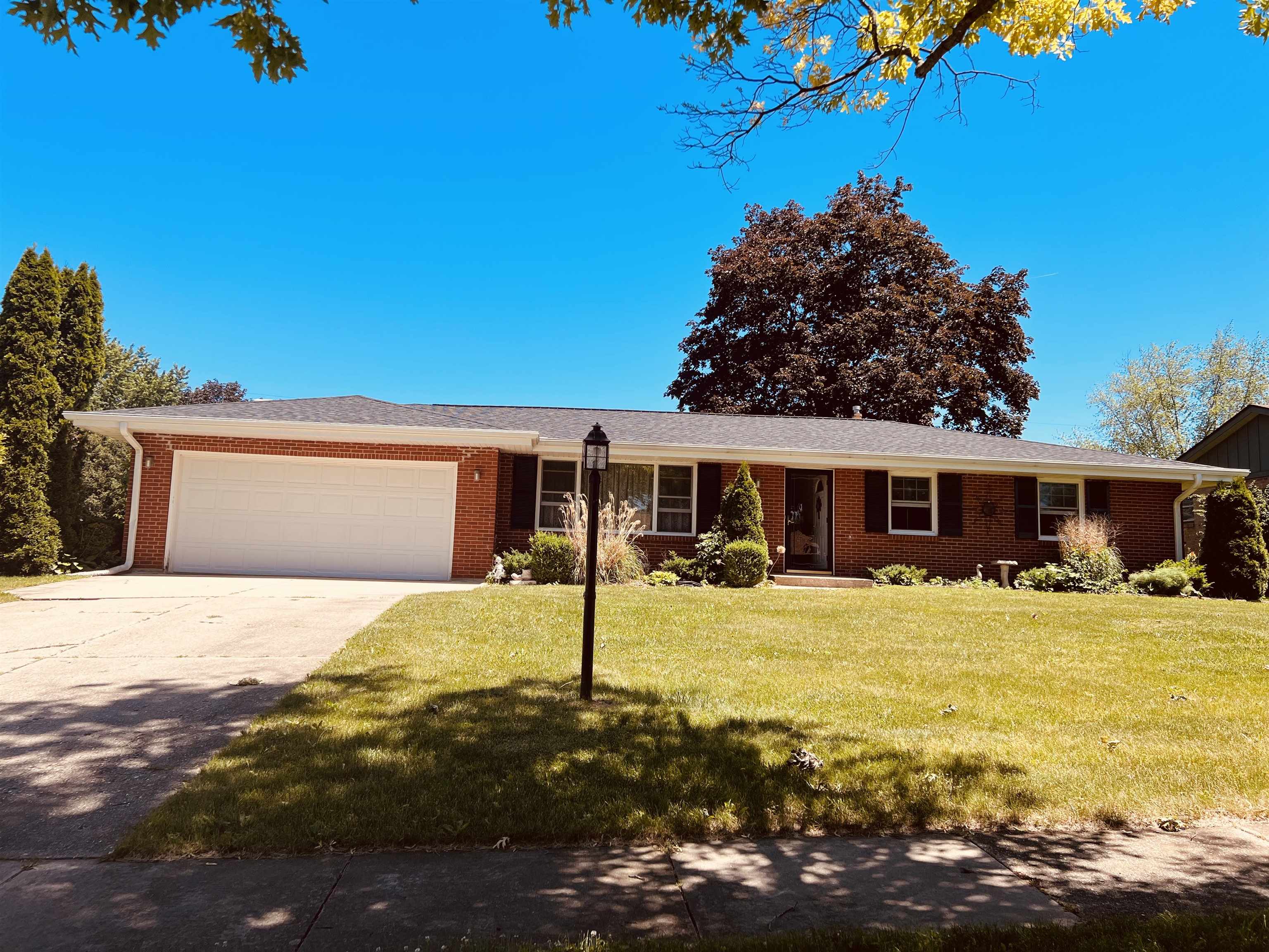 1216 Hillcrest Road Rockford, IL 61108 - Photo 1 of 13 a front view of a house with a yard