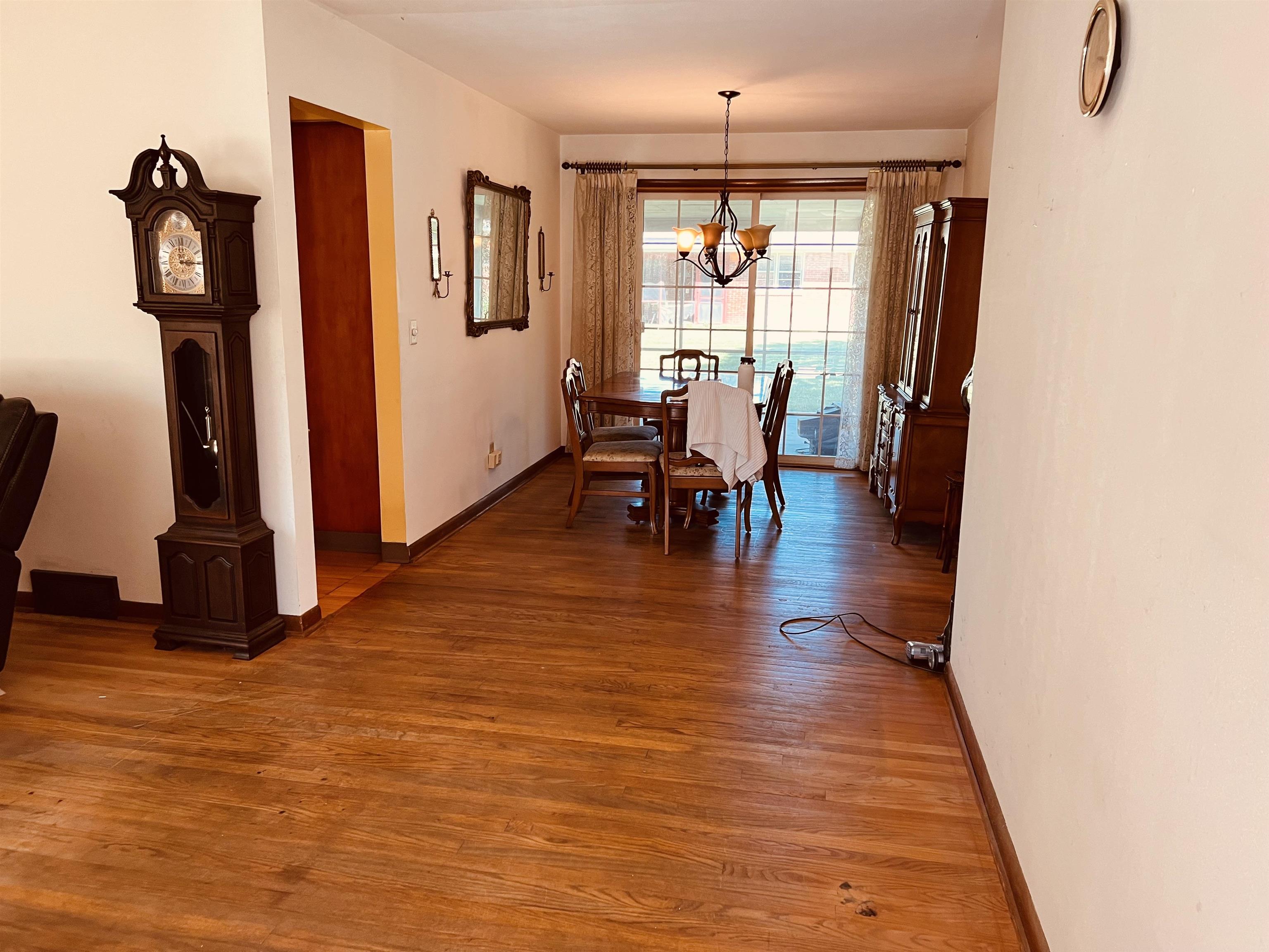 1216 Hillcrest Road Rockford, IL 61108 - Photo 3 of 13 a view of a dining room with furniture and wooden floor