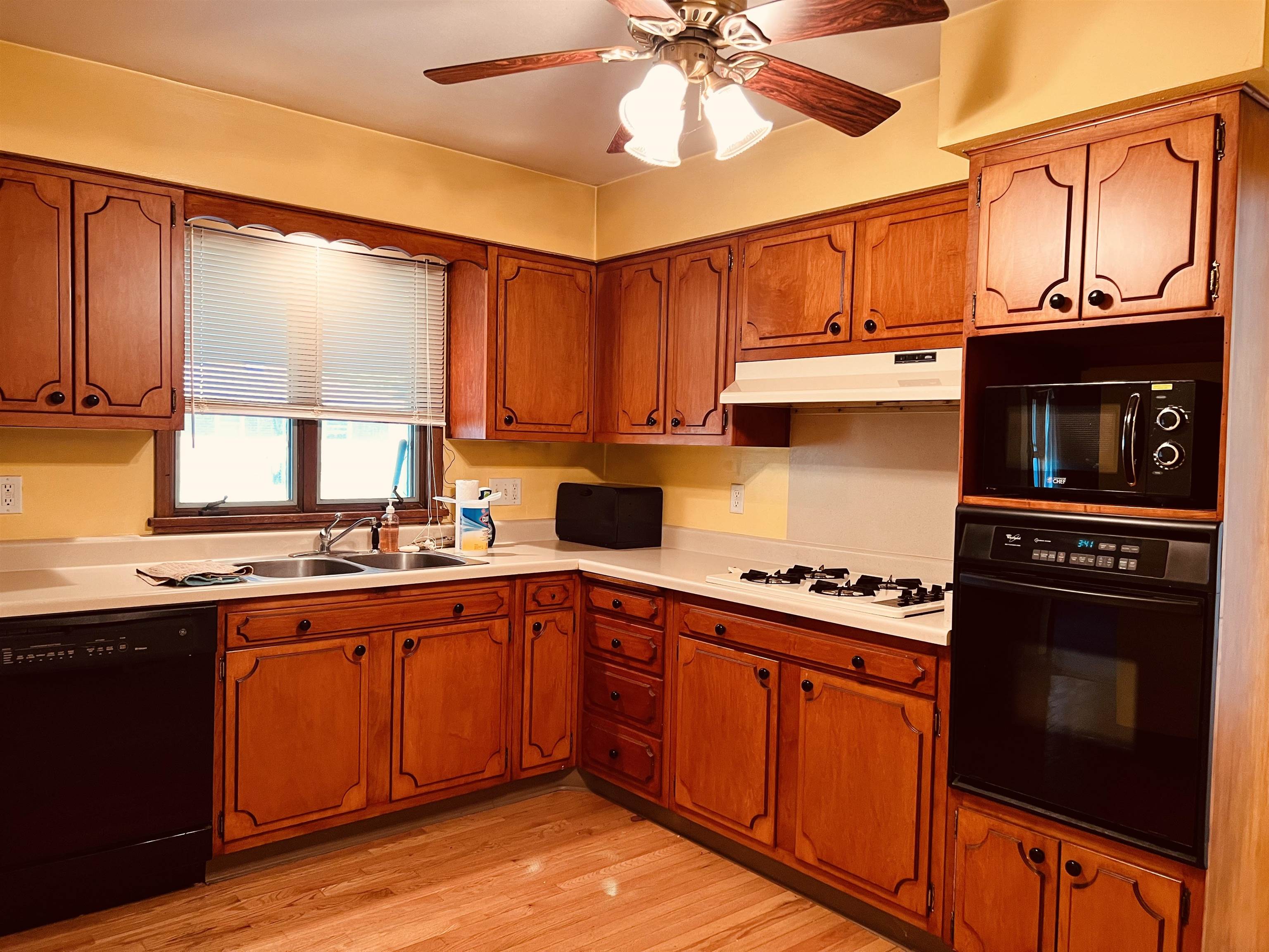 1216 Hillcrest Road Rockford, IL 61108 - Photo 6 of 13 a kitchen with stainless steel appliances a stove sink and cabinets