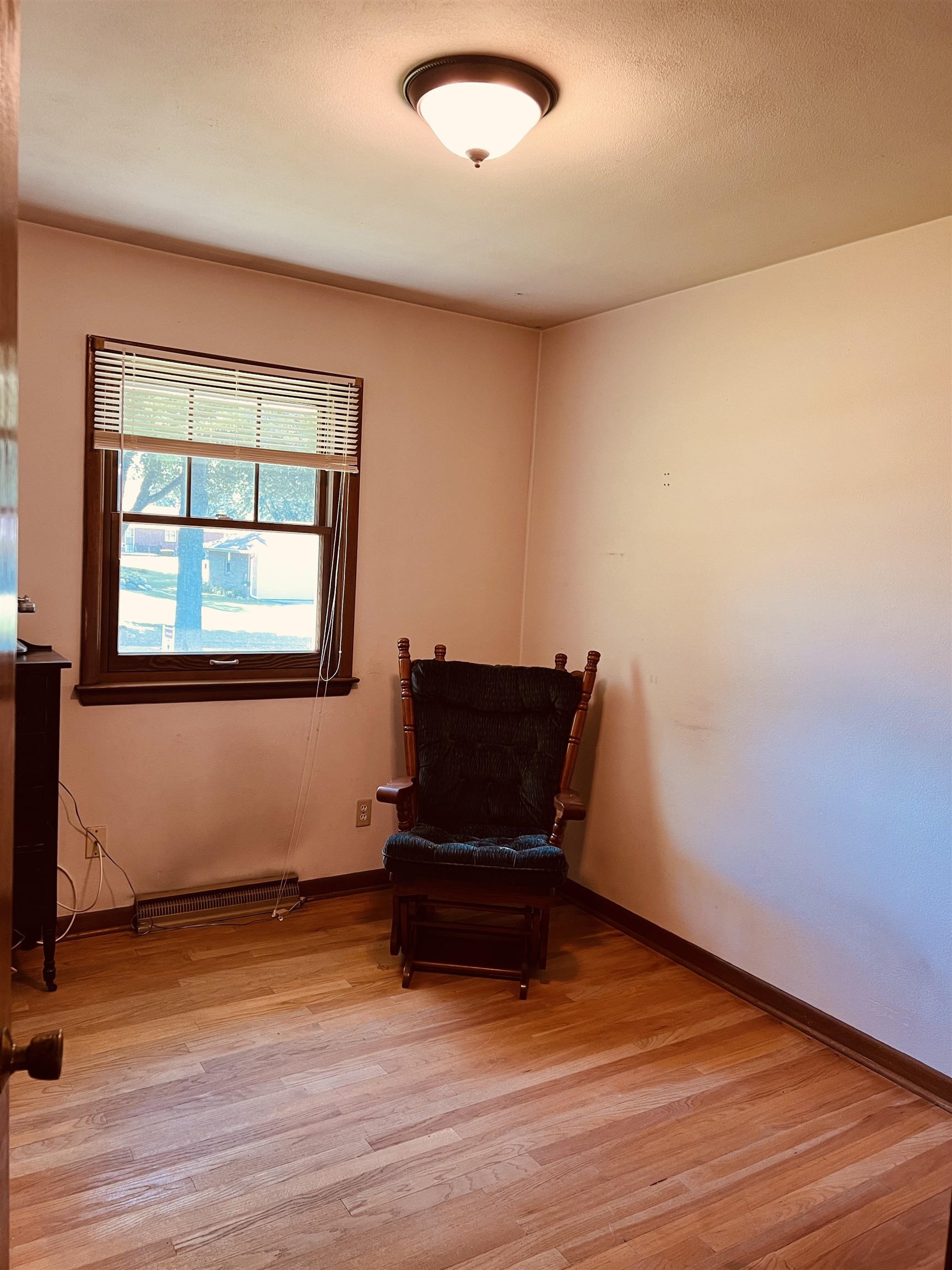 1216 Hillcrest Road Rockford, IL 61108 - Photo 9 of 13 a living room with a piano and wooden floor