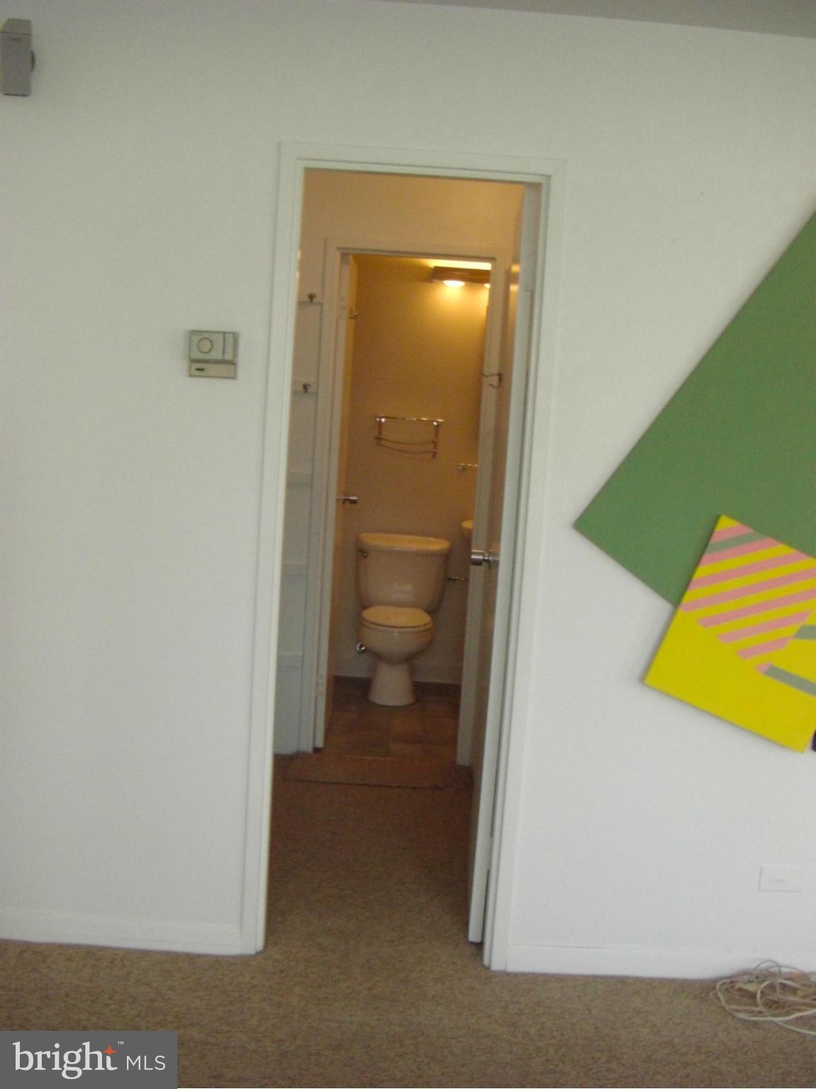 1200 North Nash Street, Unit 262 Arlington, VA 22209 - Photo 11 of 20 a bathroom with a toilet and a sink
