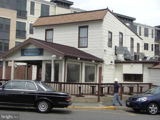 an aerial view of a house with yard swimming pool and outdoor seating
