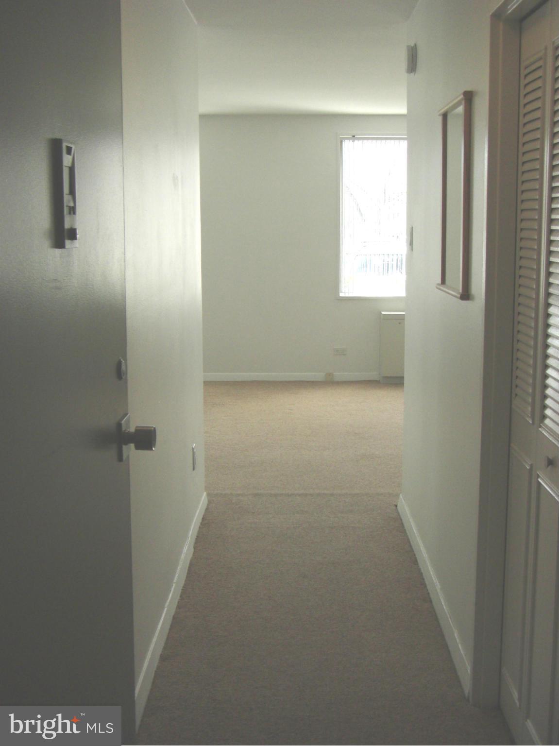 1200 North Nash Street, Unit 262 Arlington, VA 22209 - Photo 6 of 20 an empty room with windows