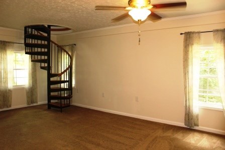 1011 Lee King Road Forsyth, GA 31029 - Photo 2 of 26 a view of walk in closet with window and wooden floor