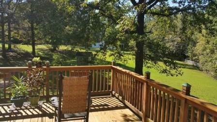 1011 Lee King Road Forsyth, GA 31029 - Photo 13 of 26 a balcony with wooden floor and yard in the back
