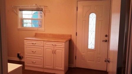 1011 Lee King Road Forsyth, GA 31029 - Photo 14 of 26 an entryway with wooden floor cabinet and a window