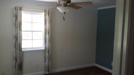 1011 Lee King Road Forsyth, GA 31029 - Photo 15 of 26 a view of a small space with wooden floor a ceiling fan and a window