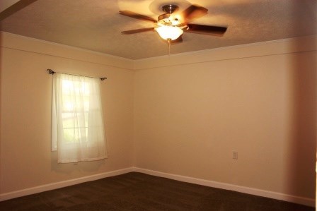 1011 Lee King Road Forsyth, GA 31029 - Photo 22 of 26 an empty room with a window and a fan