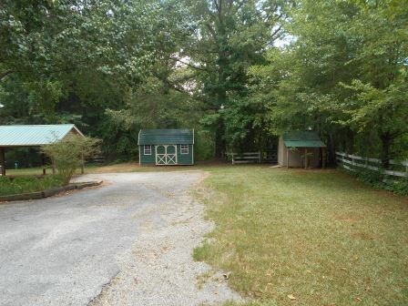 1011 Lee King Road Forsyth, GA 31029 - Photo 26 of 26 a view of a house with a yard and garage
