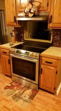 1011 Lee King Road Forsyth, GA 31029 - Photo 9 of 26 a stove top oven sitting inside of a kitchen