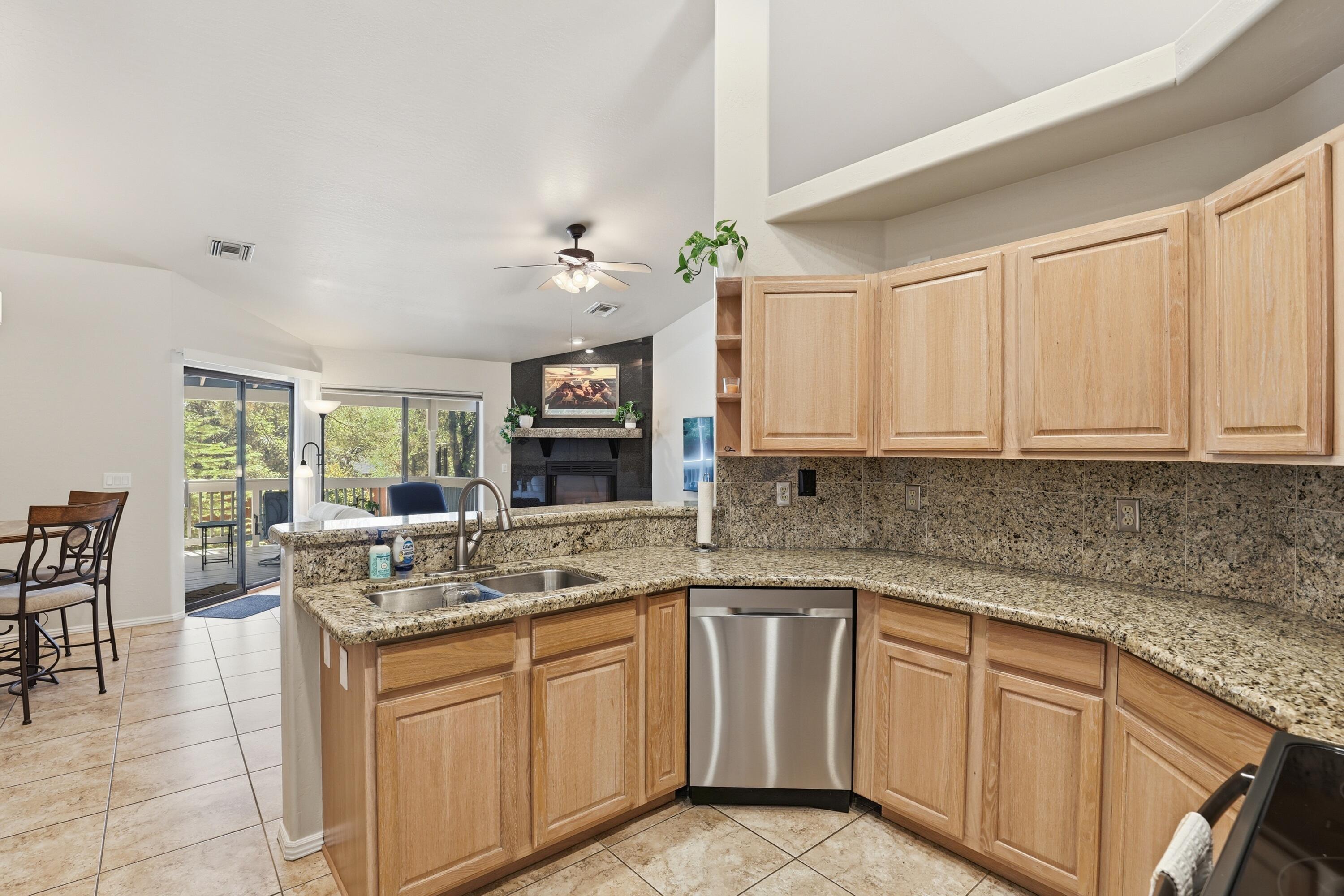 910 West Wagon Trail Payson, AZ 85541 - Photo 8 of 35 a kitchen with stainless steel appliances granite countertop a sink stove and cabinets