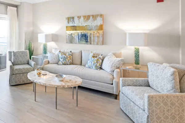 a living room with furniture and a large window