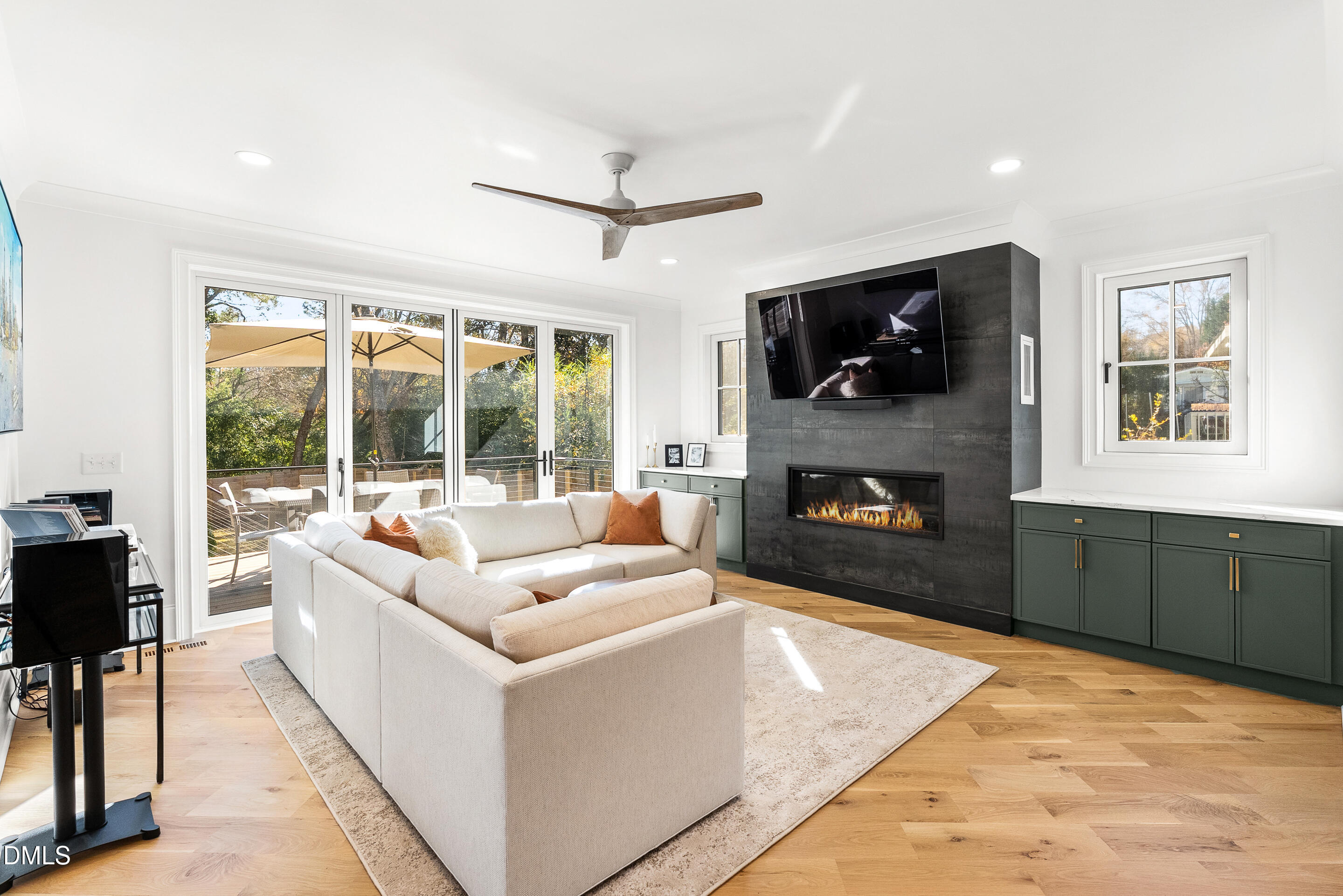 1232 Somerset Road Raleigh, NC 27610 - Photo 13 of 46 a living room with fireplace furniture and a flat screen tv