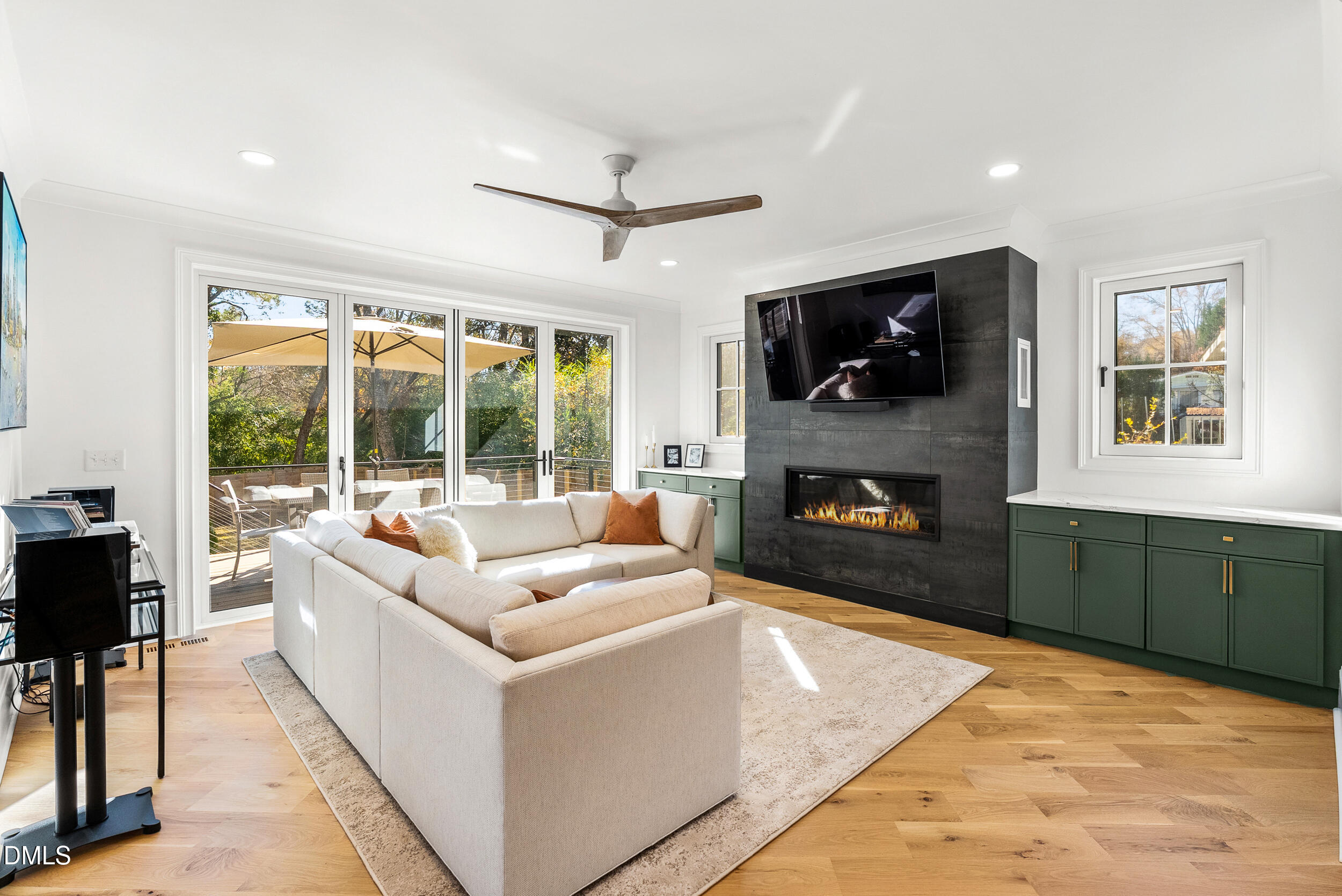 1232 Somerset Road Raleigh, NC 27610 - Photo 14 of 57 a living room with fireplace furniture and a flat screen tv