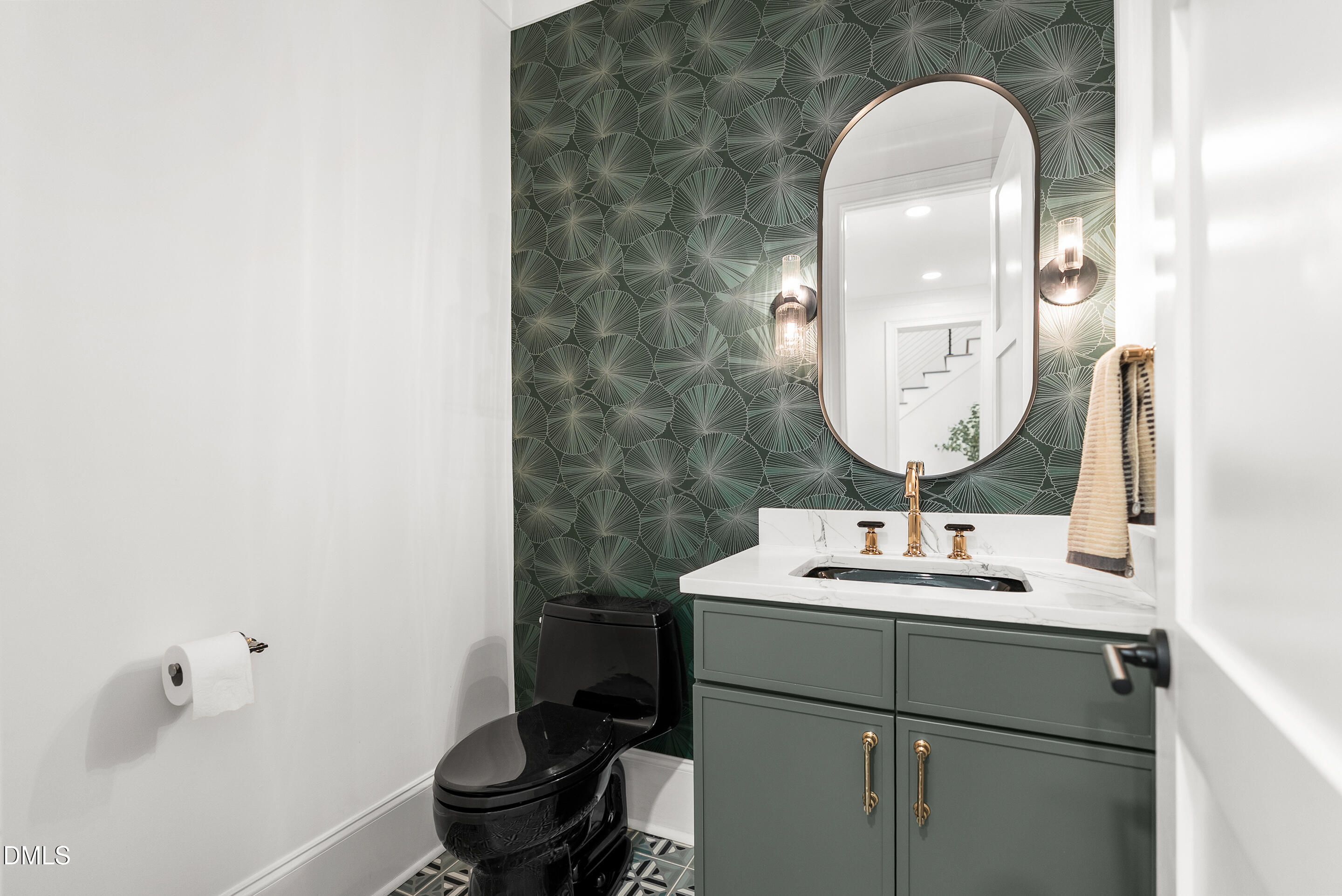 1232 Somerset Road Raleigh, NC 27610 - Photo 16 of 46 a bathroom with a sink toilet and a mirror