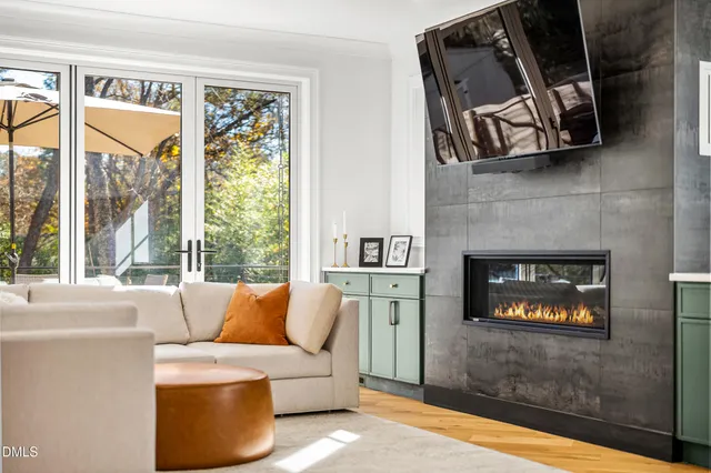 a living room with couch and a large window