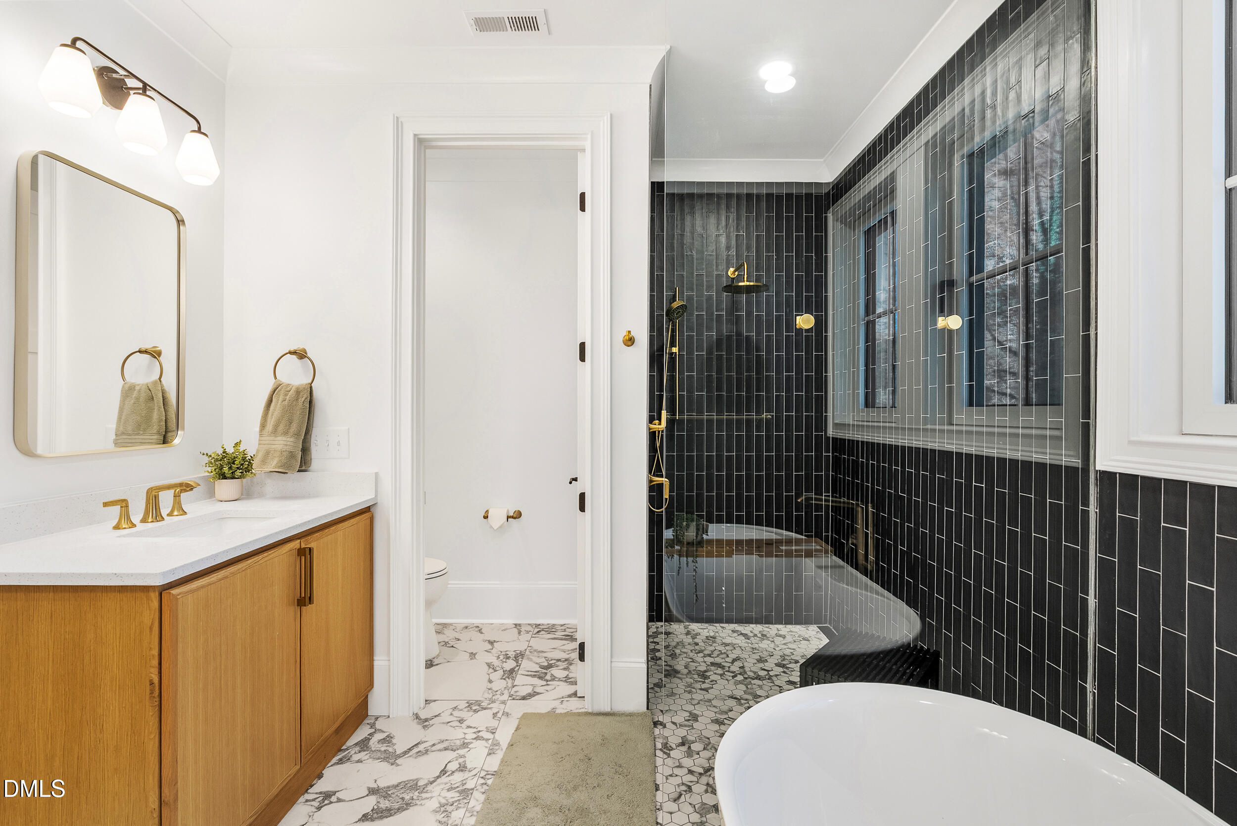 1232 Somerset Road Raleigh, NC 27610 - Photo 22 of 46 a bathroom with a sink toilet and shower