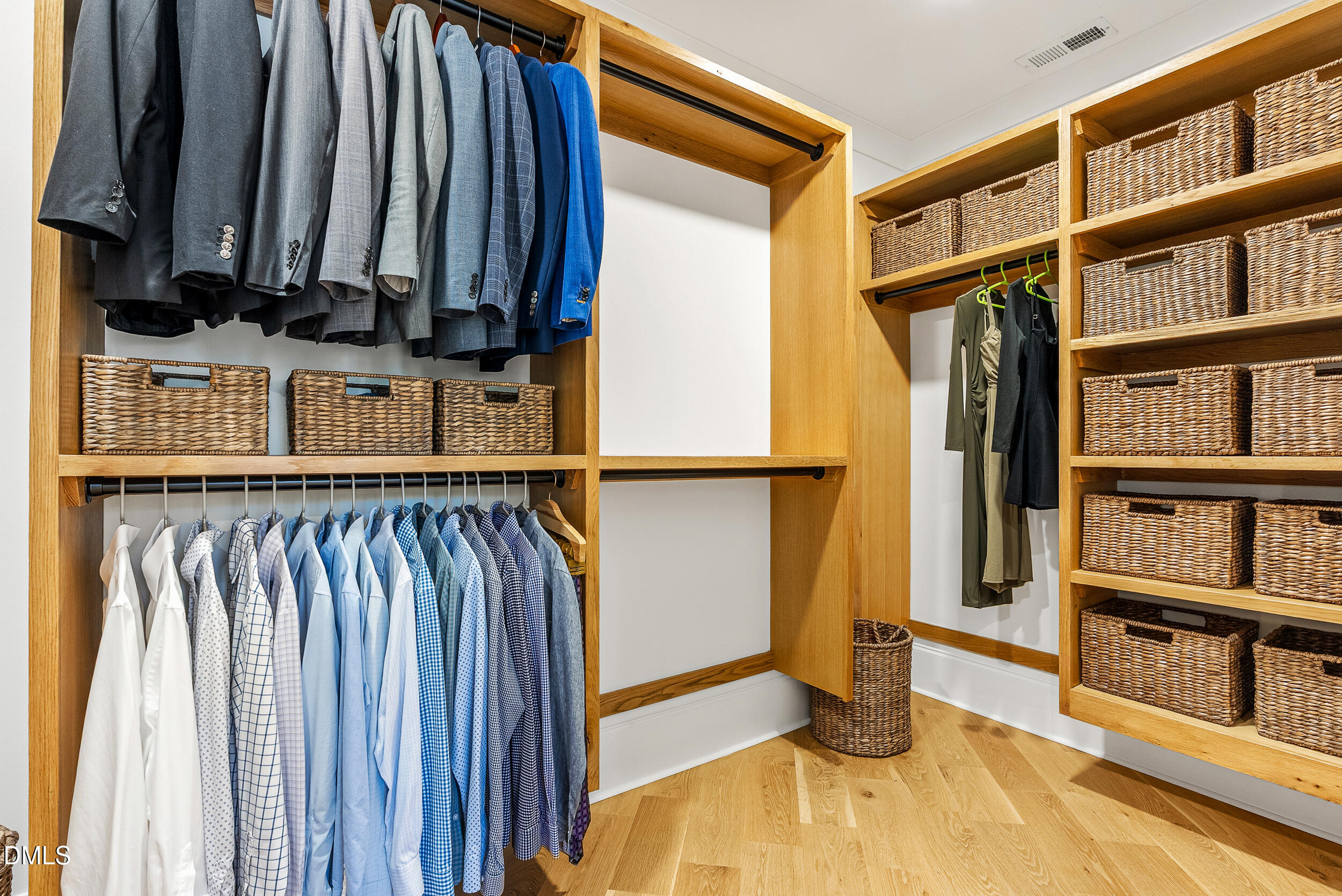 1232 Somerset Road Raleigh, NC 27610 - Photo 24 of 46 a view of walk in closet with clothes and shoes