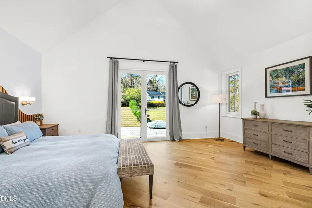 a bedroom with a bed and dresser