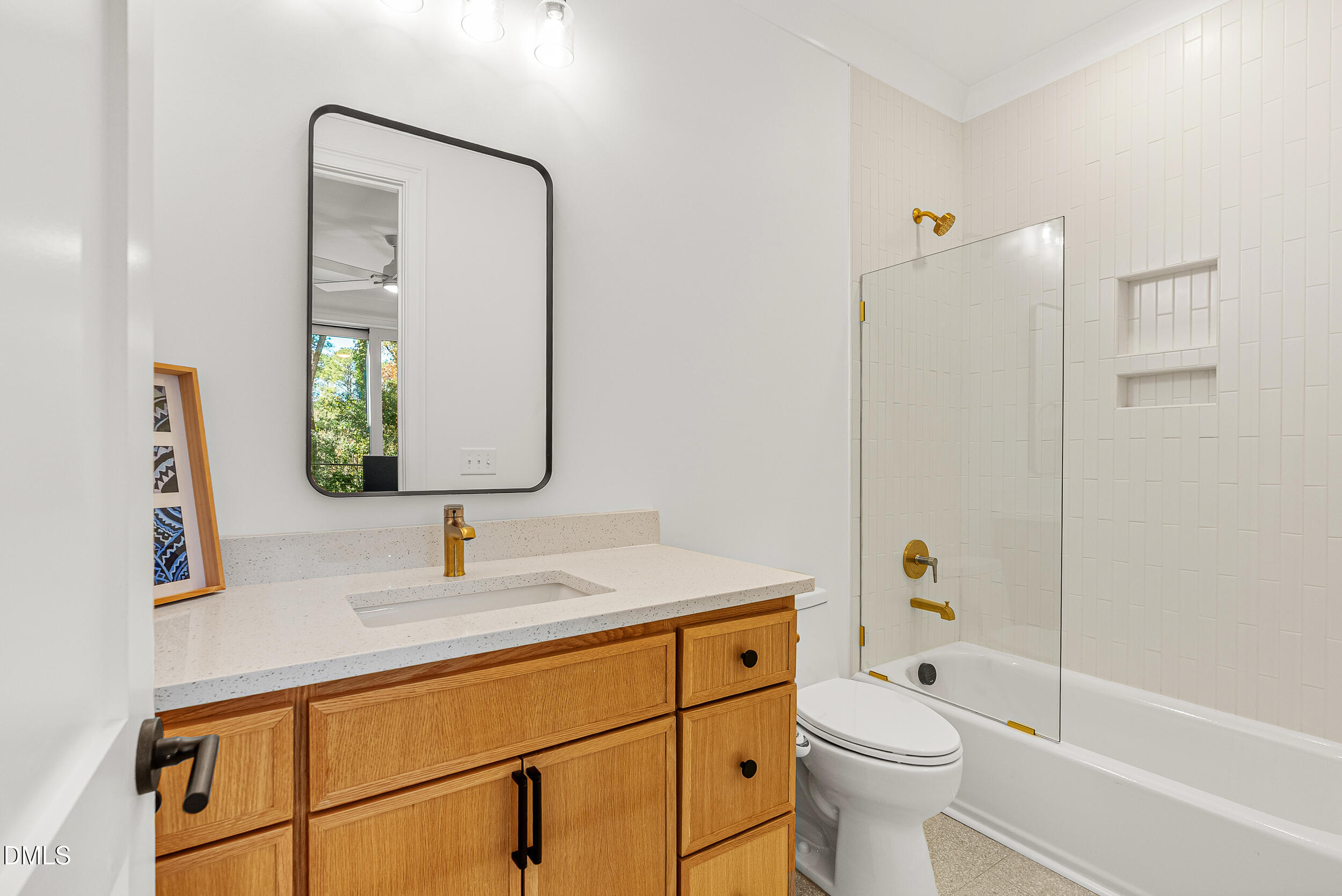 1232 Somerset Road Raleigh, NC 27610 - Photo 32 of 46 a bathroom with a toilet a sink a tub and mirror