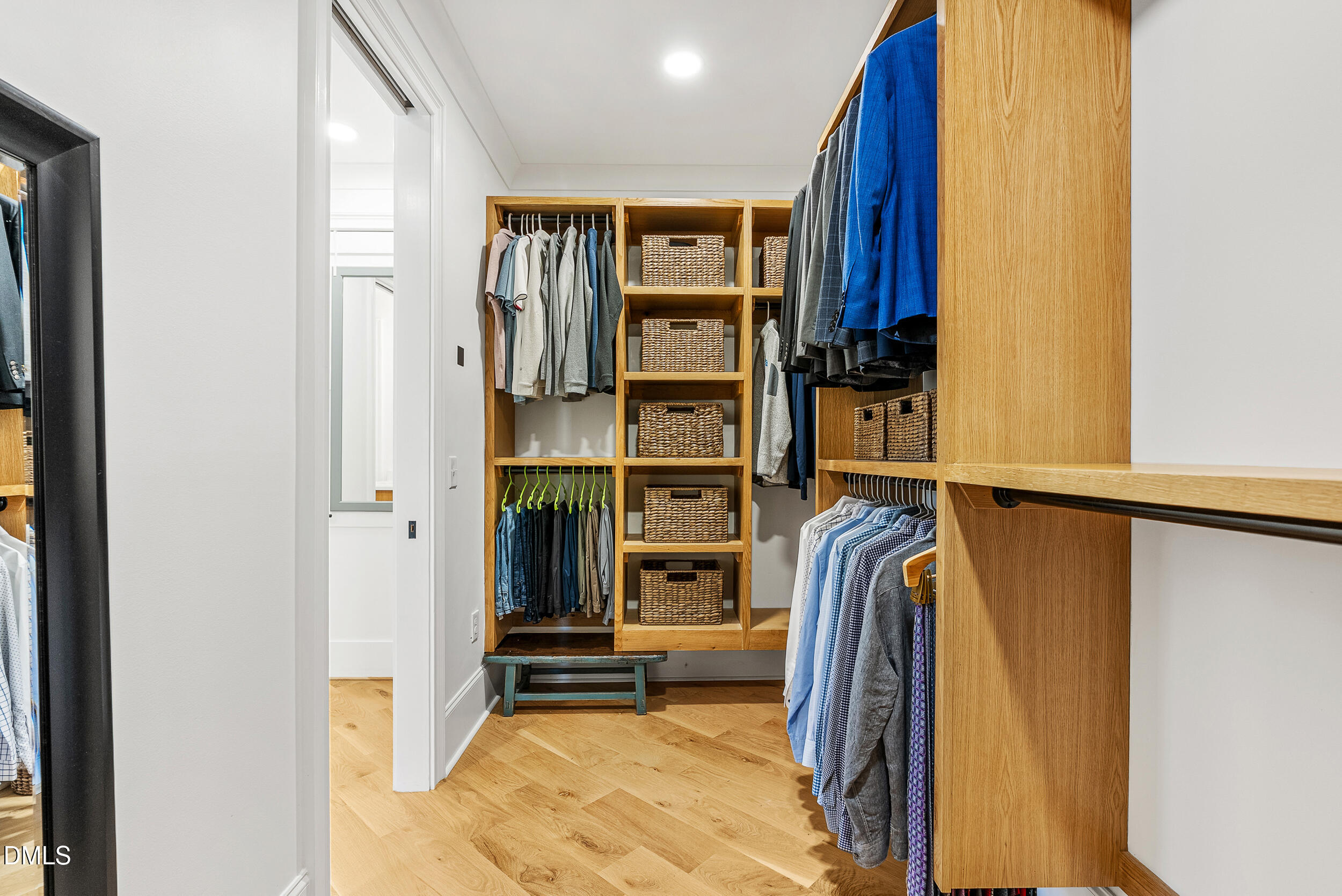 1232 Somerset Road Raleigh, NC 27610 - Photo 32 of 57 a view of walk in closet with clothes and shoes