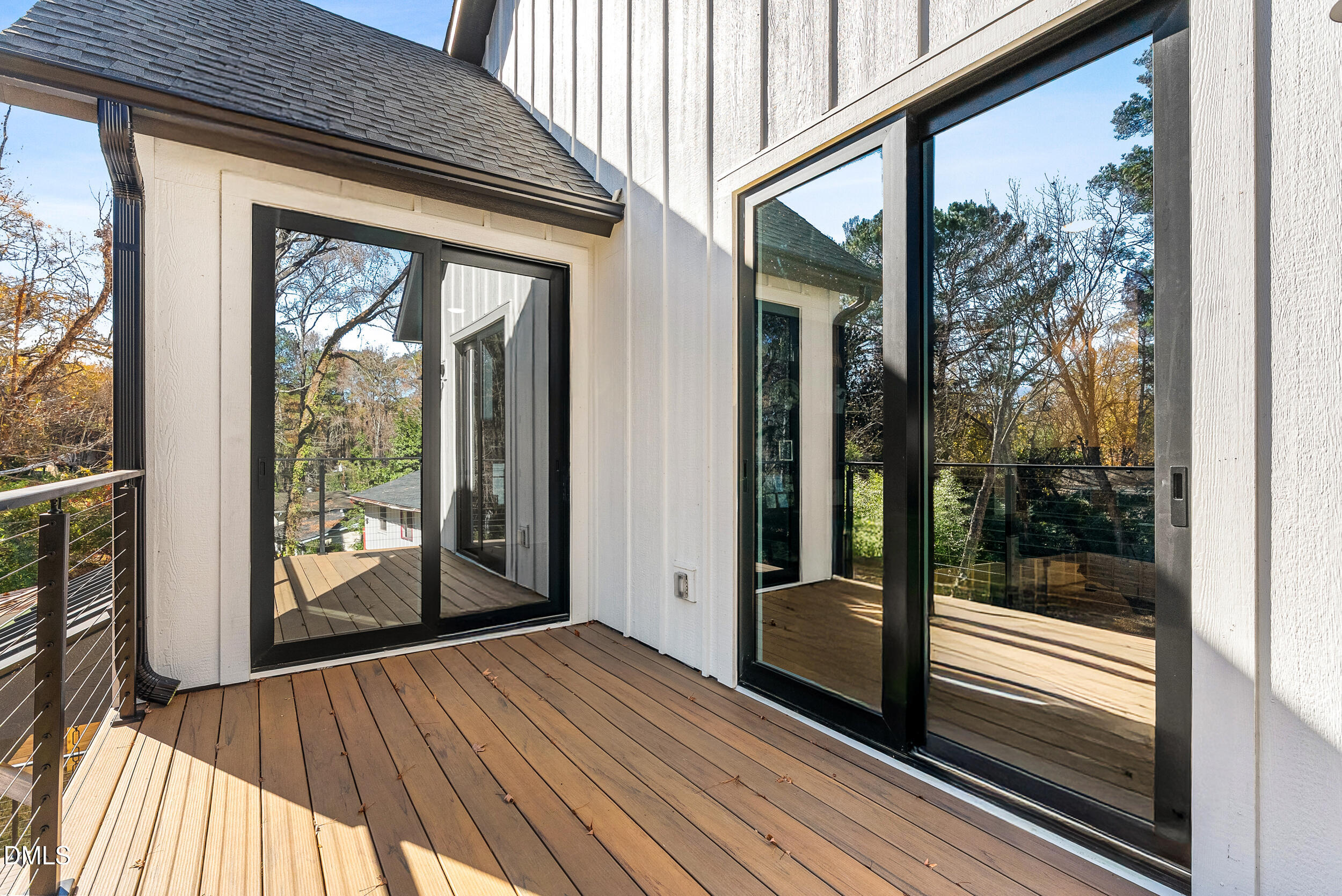 1232 Somerset Road Raleigh, NC 27610 - Photo 33 of 46 a view of a room with wooden floor and floor to ceiling window