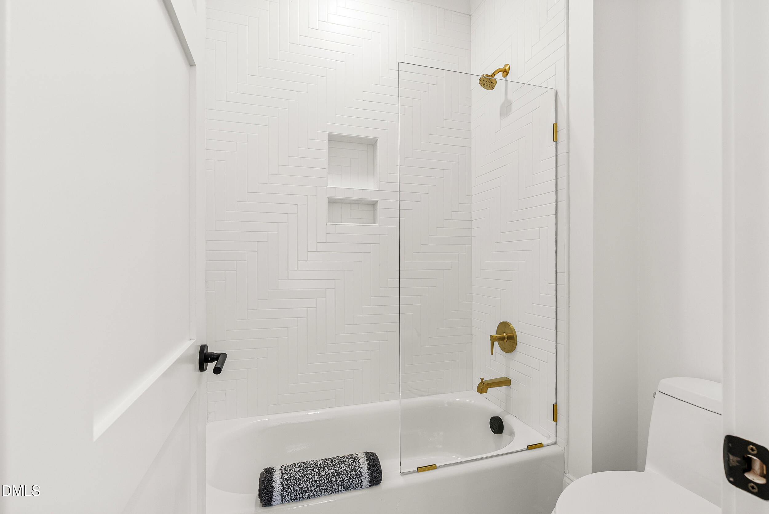 1232 Somerset Road Raleigh, NC 27610 - Photo 38 of 57 a bathroom with a bathtub and a shower