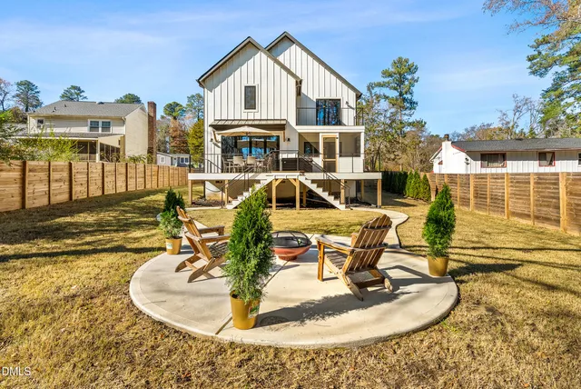 a view of swimming pool with a patio and a yard