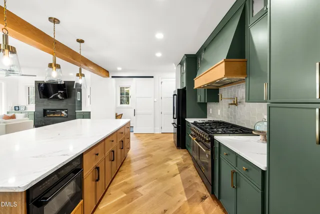 a vase of flowers sitting next to a window